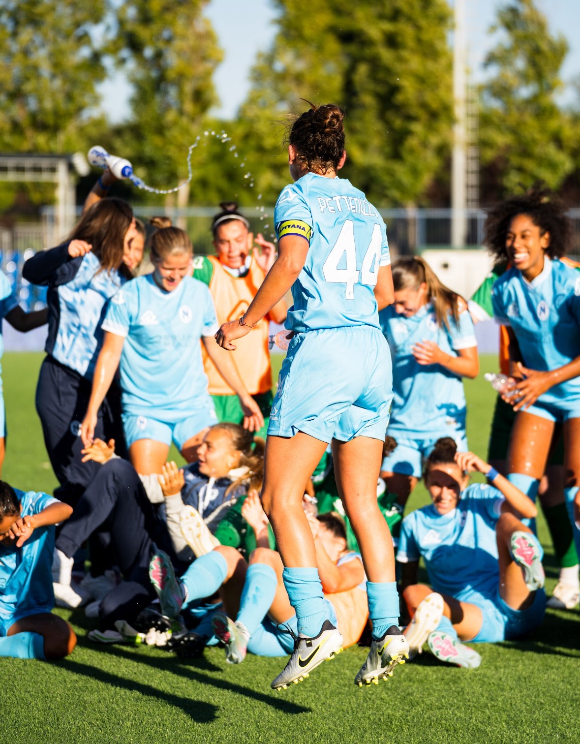 Player celebrating with teammates after a win