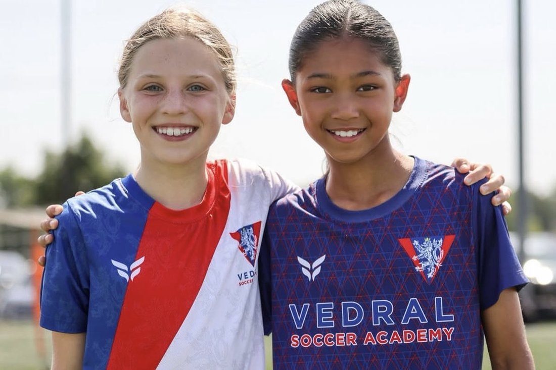 Two young athletes, arm in arm