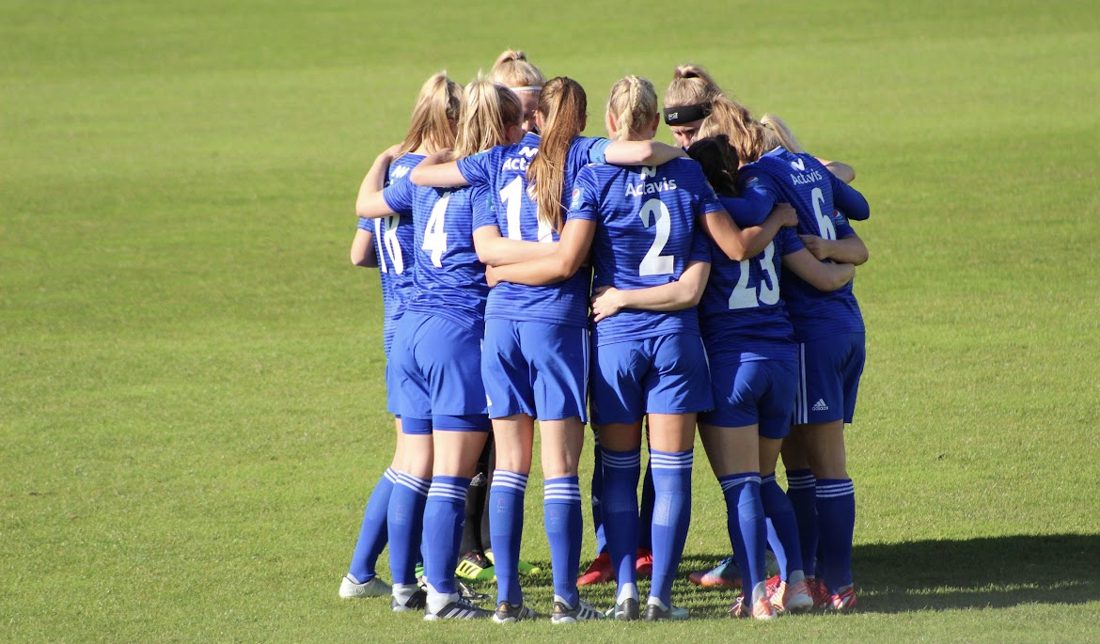 Team huddled together on the field